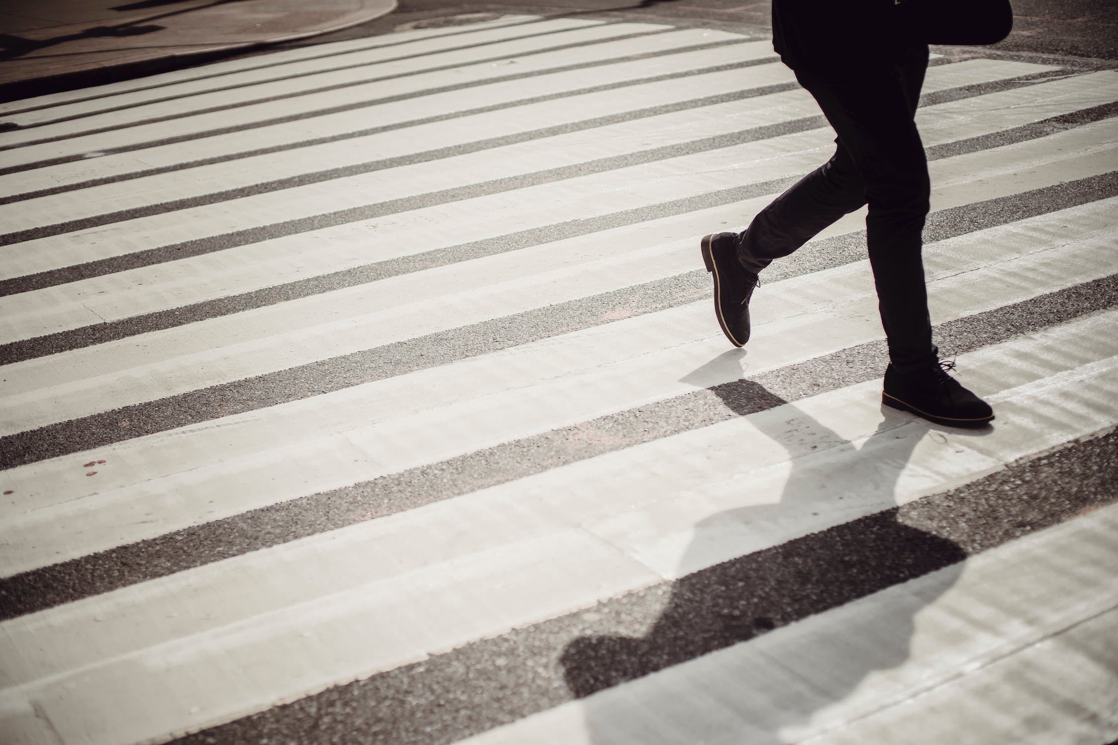 legs on a crosswalk