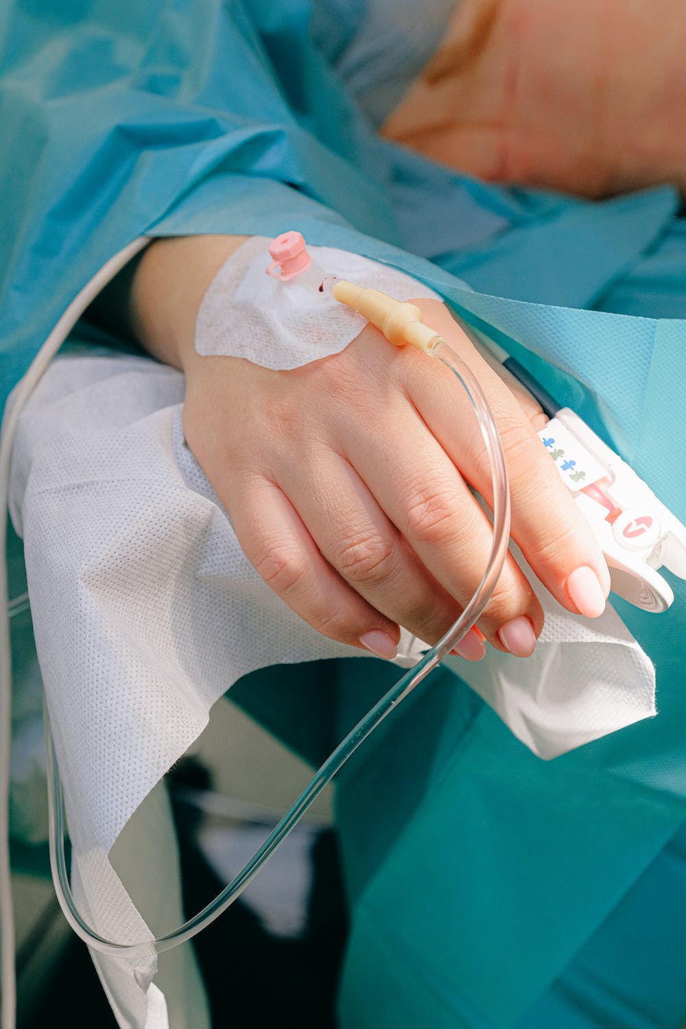 womans hand with iv port